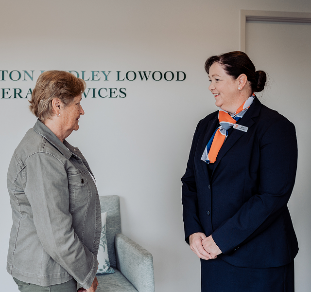Gatton funeral director greeting woman