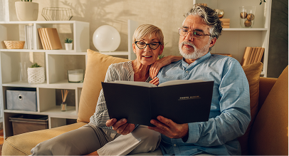 two people looking at a book