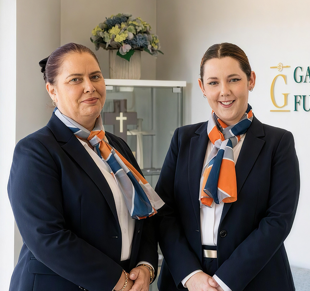 Gatton funeral director greeting woman