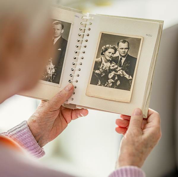 woman looking at photo album