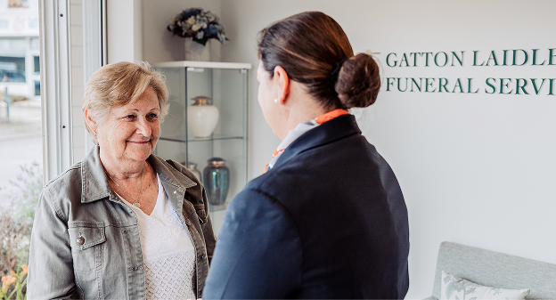Gatton funeral director greeting a woman