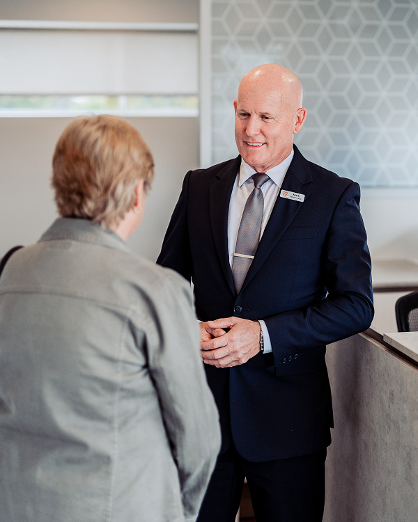 Gatton funeral director greeting a woman
